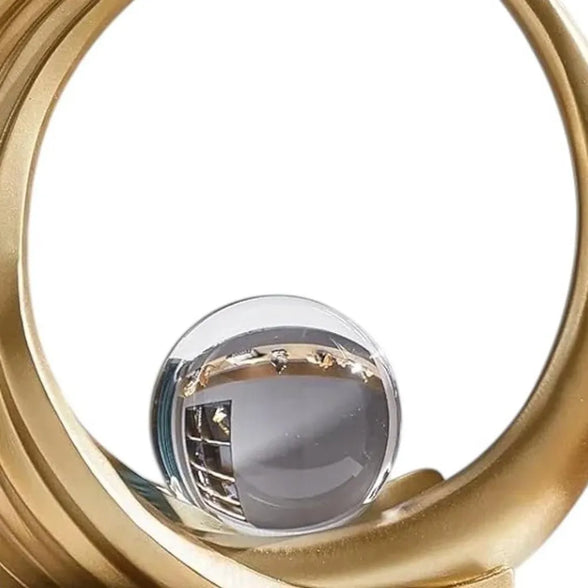 gold sphere sculpture close up