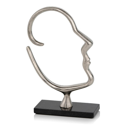 human face sculpture from left side